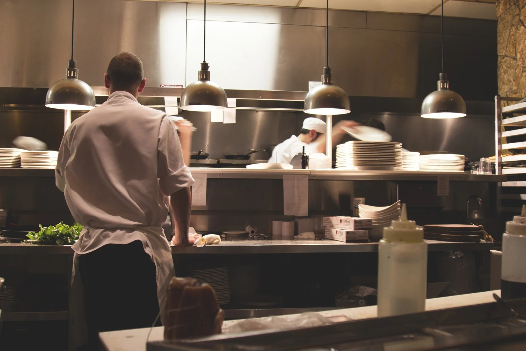 Restaurant colleagues working together in a professional kitchen